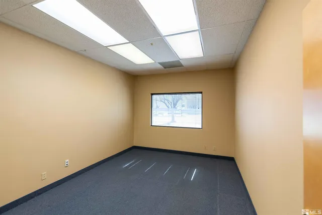 an empty room with a empty space and a window