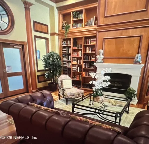 a view of swimming pool with outdoor seating and yard in the back