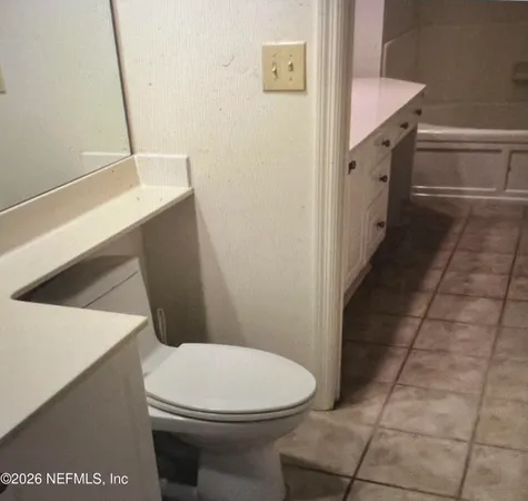 a bathroom with a toilet and a sink