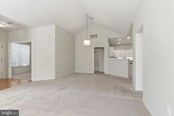 a view of a big room with windows and cabinet