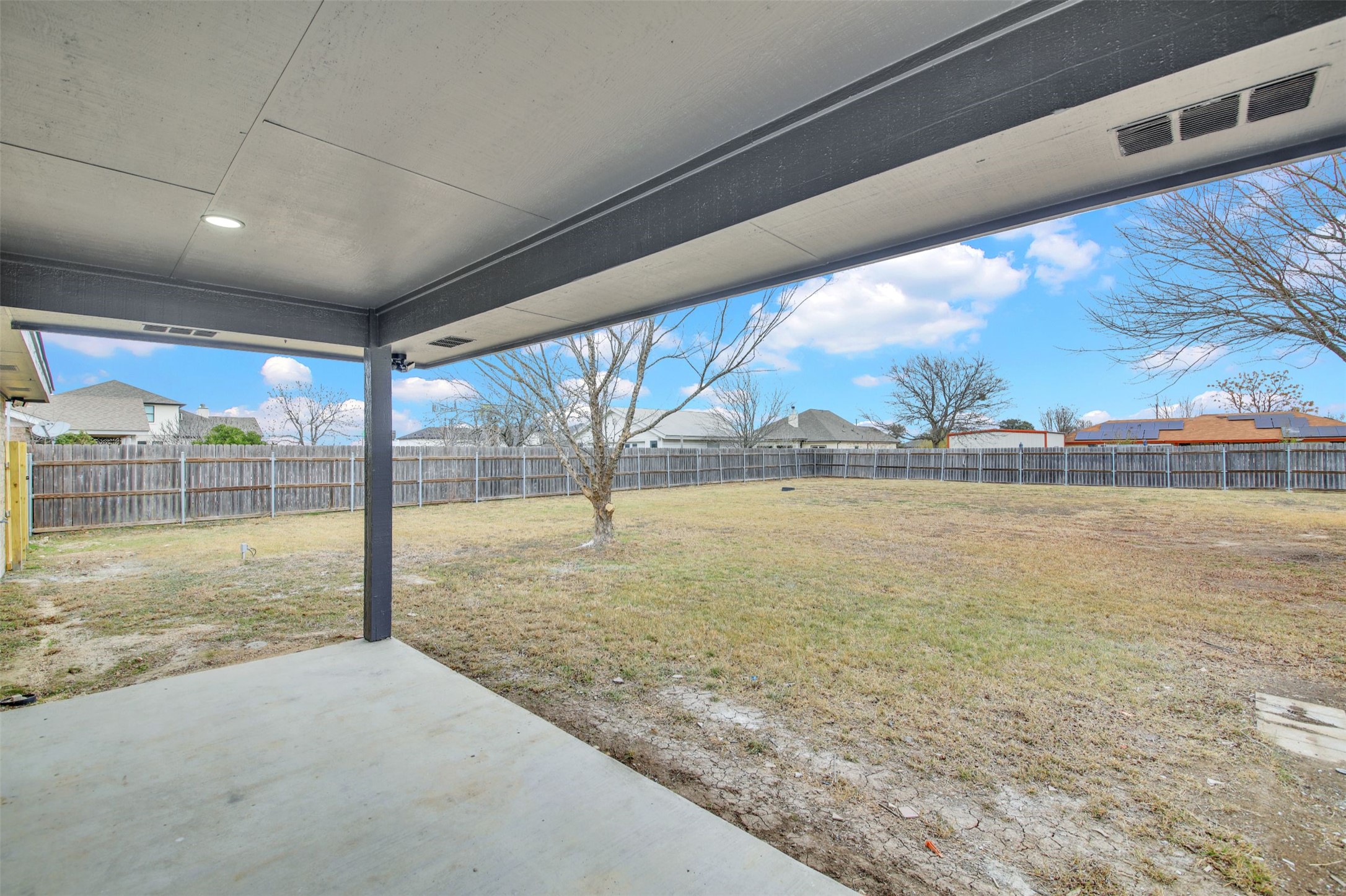 131 Meadow Valley Loop Jarrell, TX 76537 - Photo 24 of 32 Back yard with a covered patio