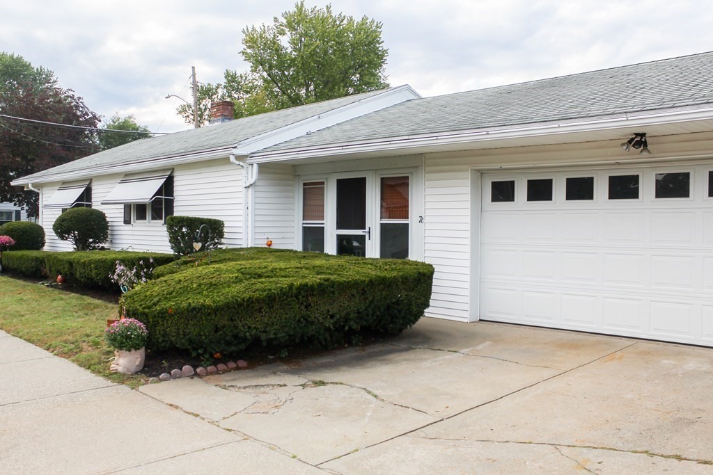 76 Embury Street Springfield, MA 01109 - Photo 2 of 18 a view of a house with a yard