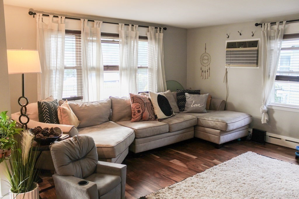 76 Embury Street Springfield, MA 01109 - Photo 3 of 18 a living room with furniture and a large window