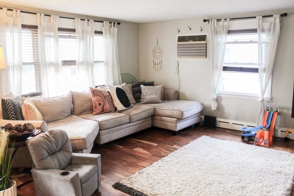 76 Embury Street Springfield, MA 01109 - Photo 4 of 18 a living room with furniture and a window