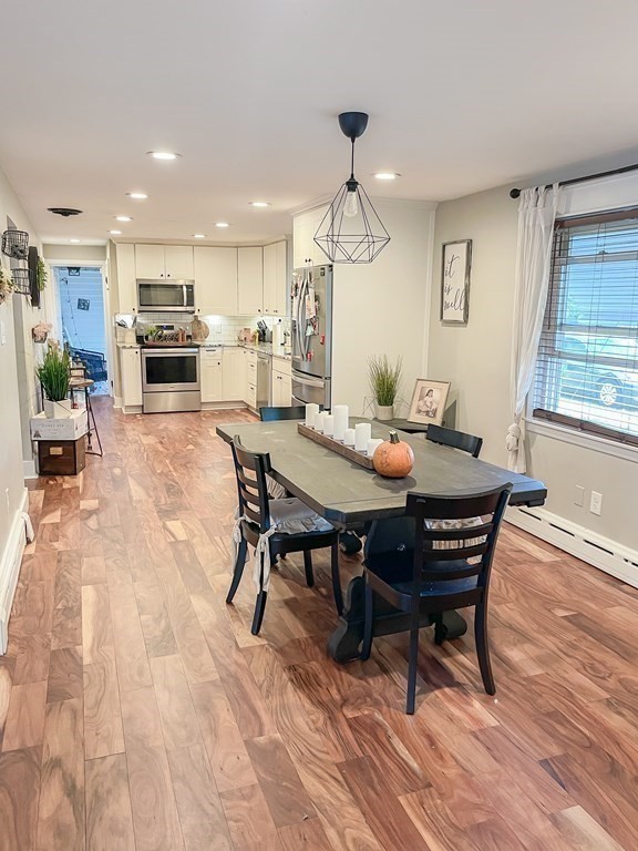 76 Embury Street Springfield, MA 01109 - Photo 5 of 18 a view of a dining room with furniture window and wooden floor