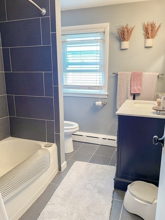 76 Embury Street Springfield, MA 01109 - Photo 9 of 18 a bathroom with a toilet a sink and a bathtub