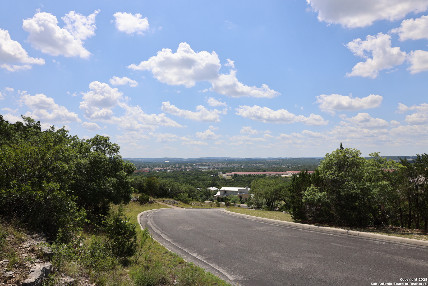 25219 Rocky Hill Road San Antonio, TX 78257 - Photo 9 of 15 a view of a city street and a lot of trees