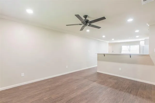 a view of a backyard with a garden and entertaining space