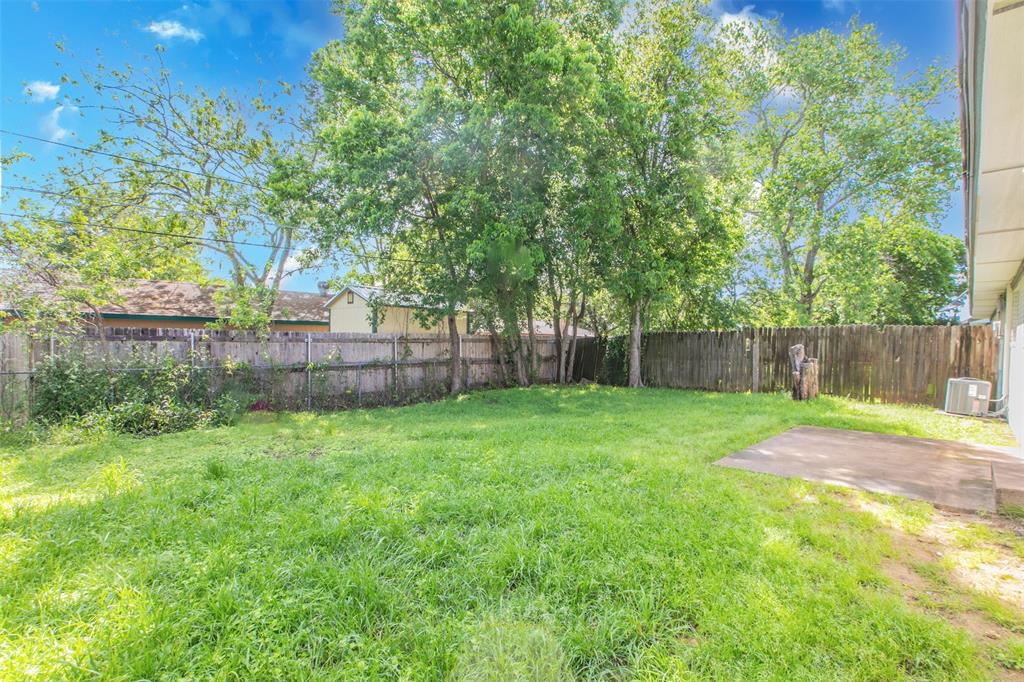 600-614 Riggins Street Robinson, TX 76706 - Photo 15 of 16 a view of a backyard with a garden and entertaining space