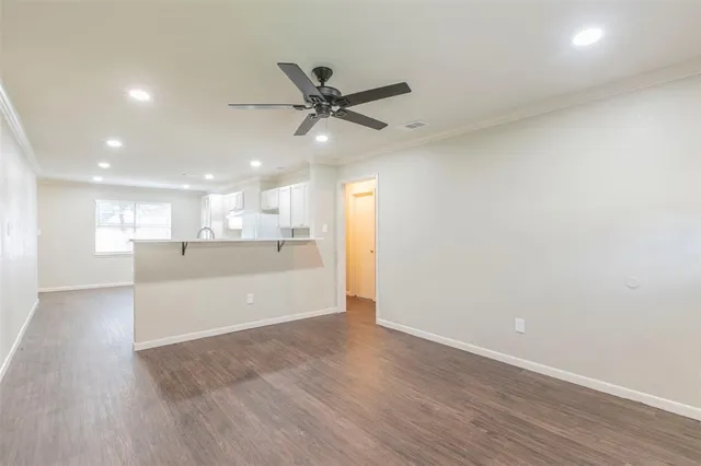 a kitchen with refrigerator and window