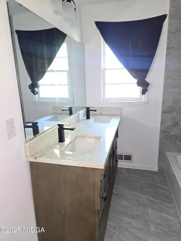 a dining room with table and window