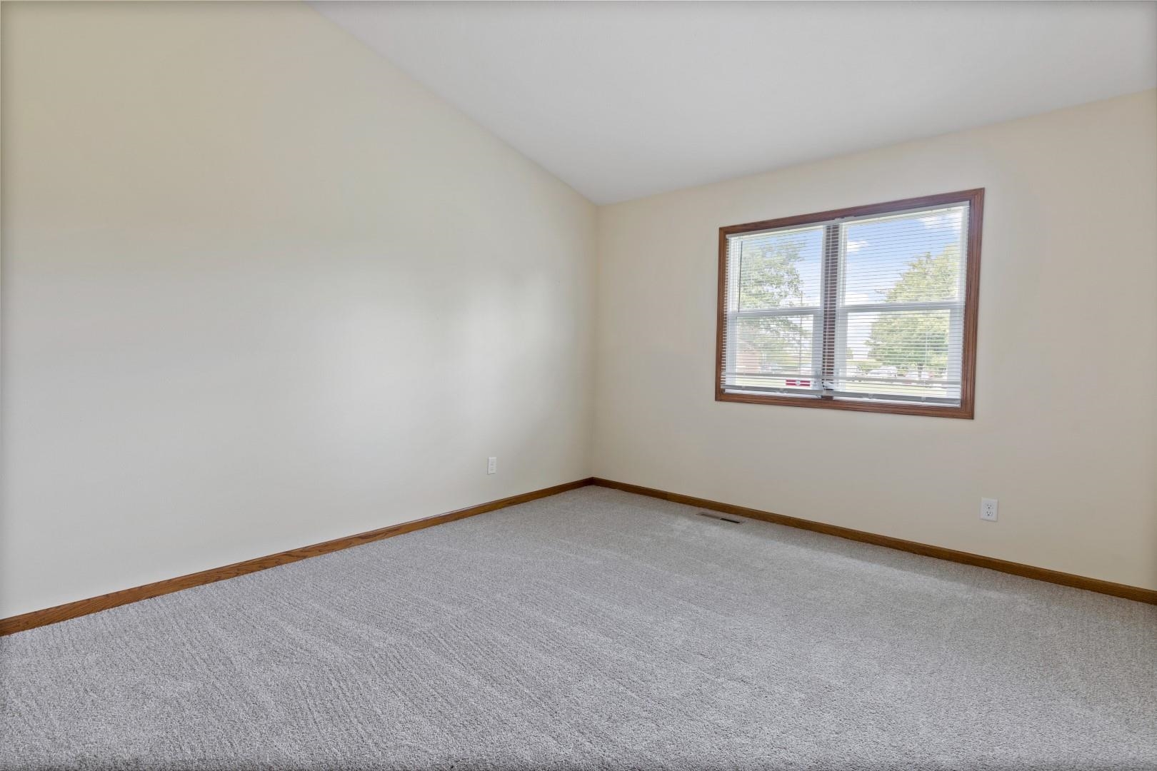 6682 North Point Road Rockford, IL 61108 - Photo 18 of 34 an empty room with a window