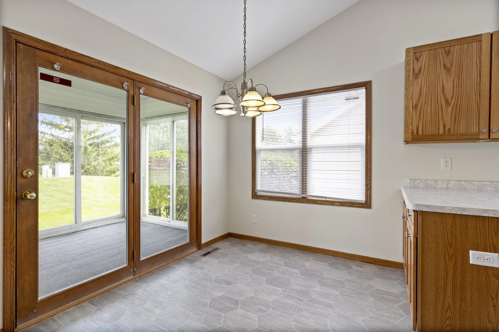6682 North Point Road Rockford, IL 61108 - Photo 9 of 34 a view of a room with window wooden floor and cabinet
