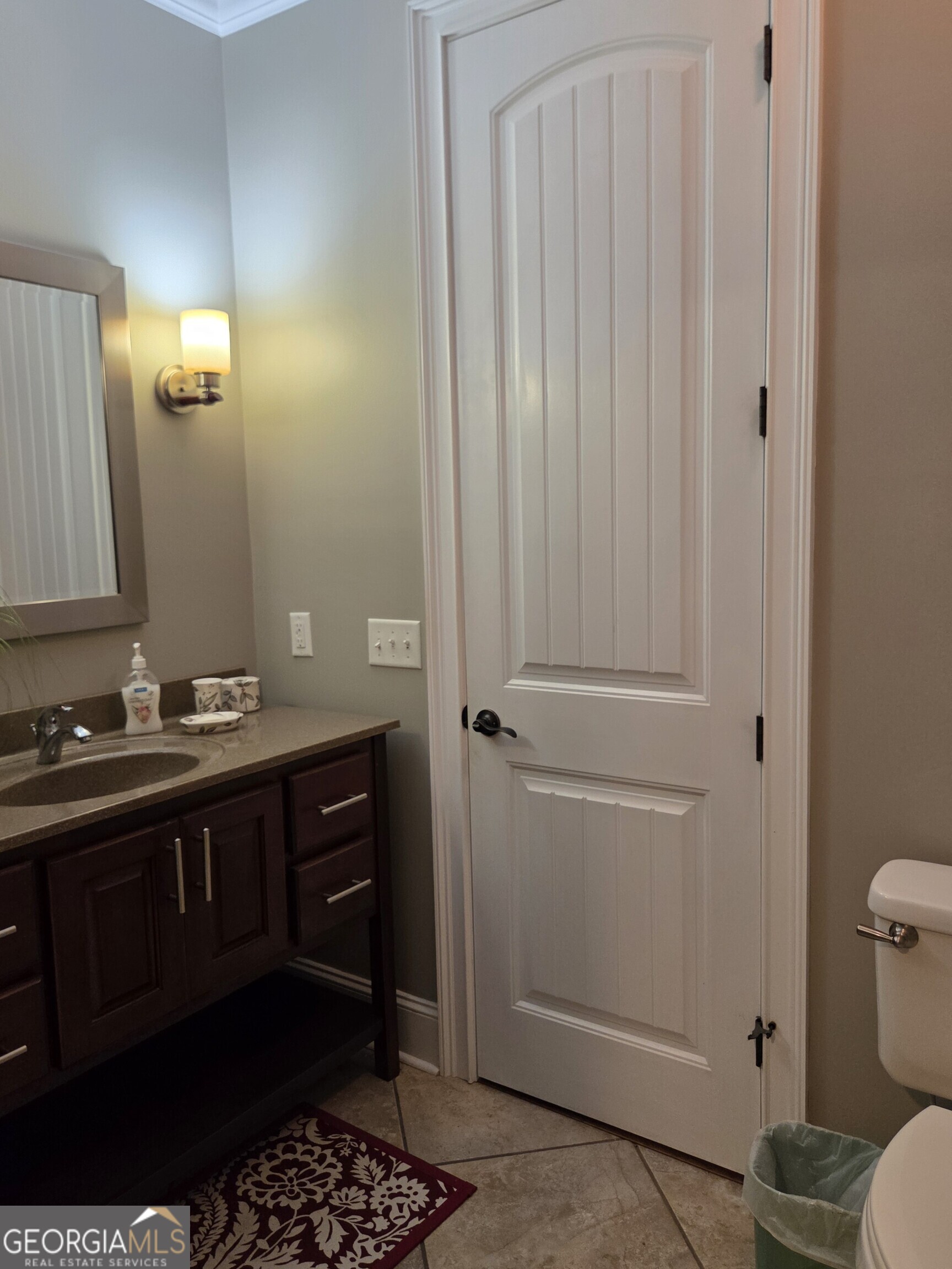 300 Hammond Powell Road Hazlehurst, GA 31539 - Photo 83 of 91 a bathroom with a sink and a mirror with toilet