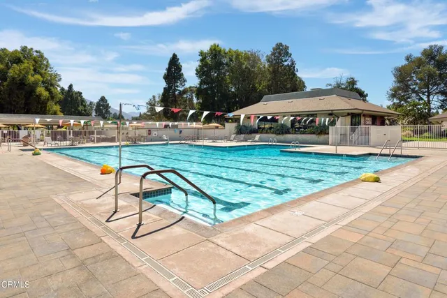 a view of a swimming pool with a lounge chairs