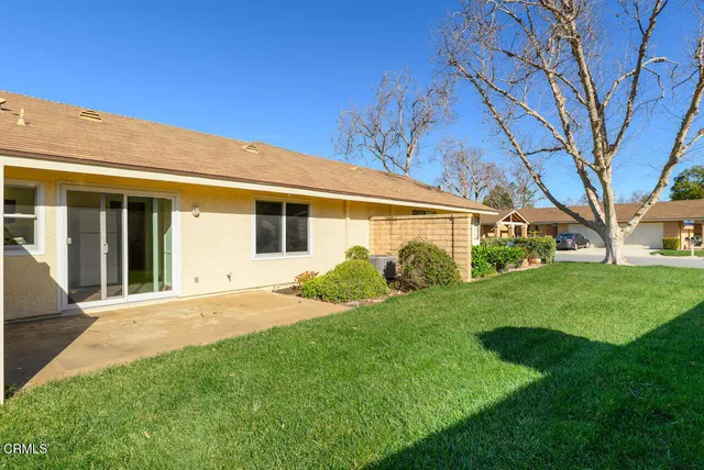 a view of a yard in front of a house