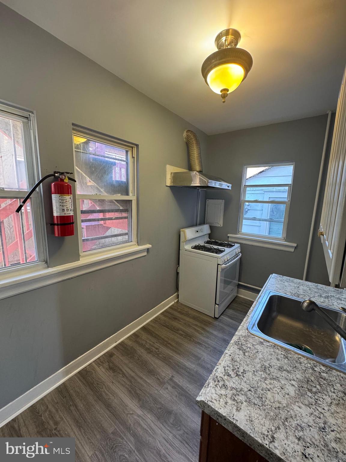 36 North Hartford Avenue Atlantic City, NJ 08401 - Photo 8 of 8 a kitchen that has a microwave and a stove
