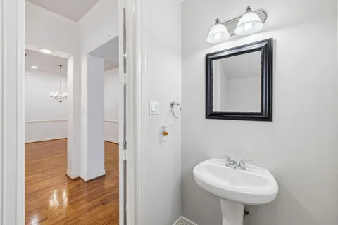 a bathroom with a sink a mirror and a shower