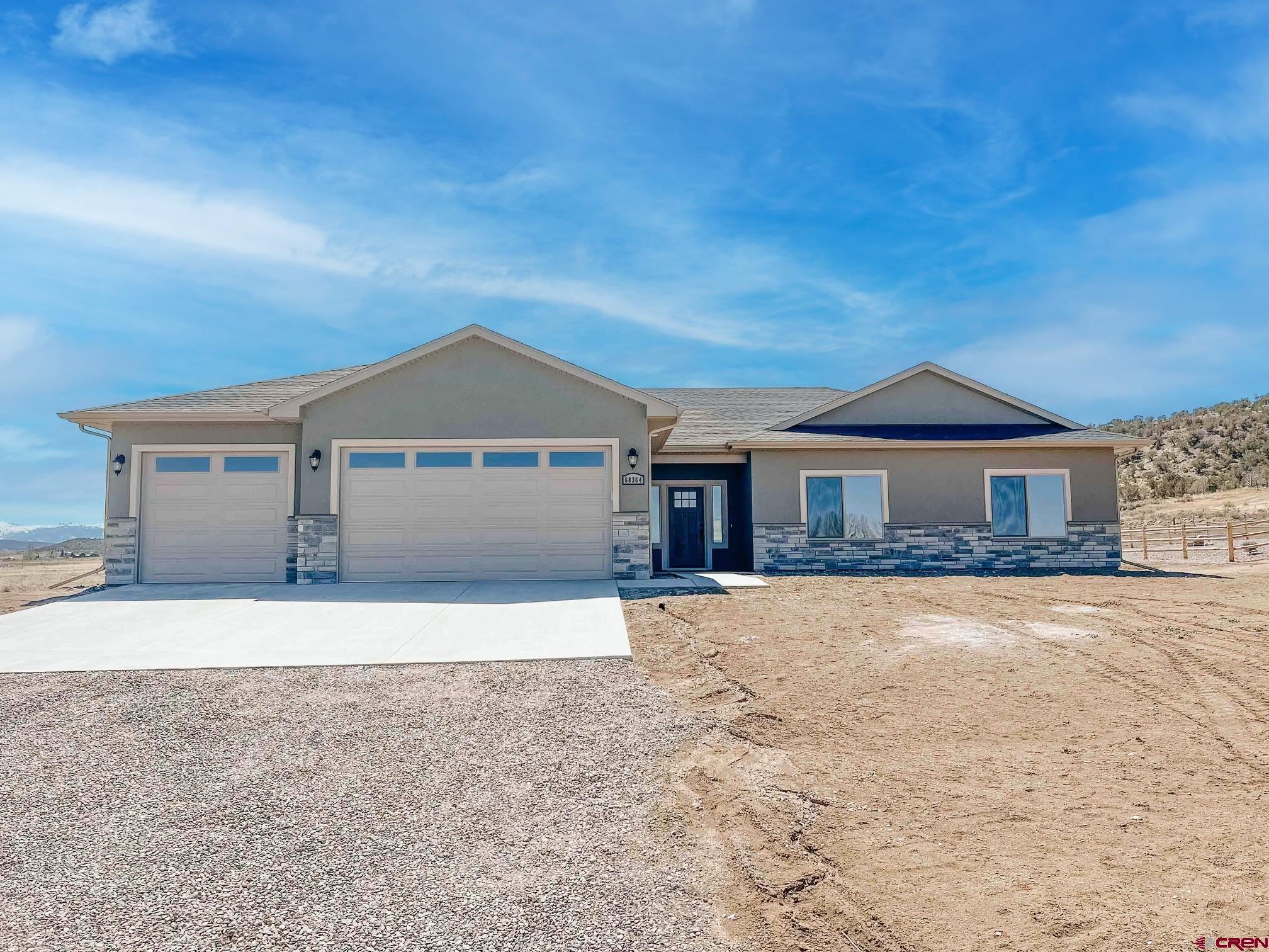 a front view of a house with yard