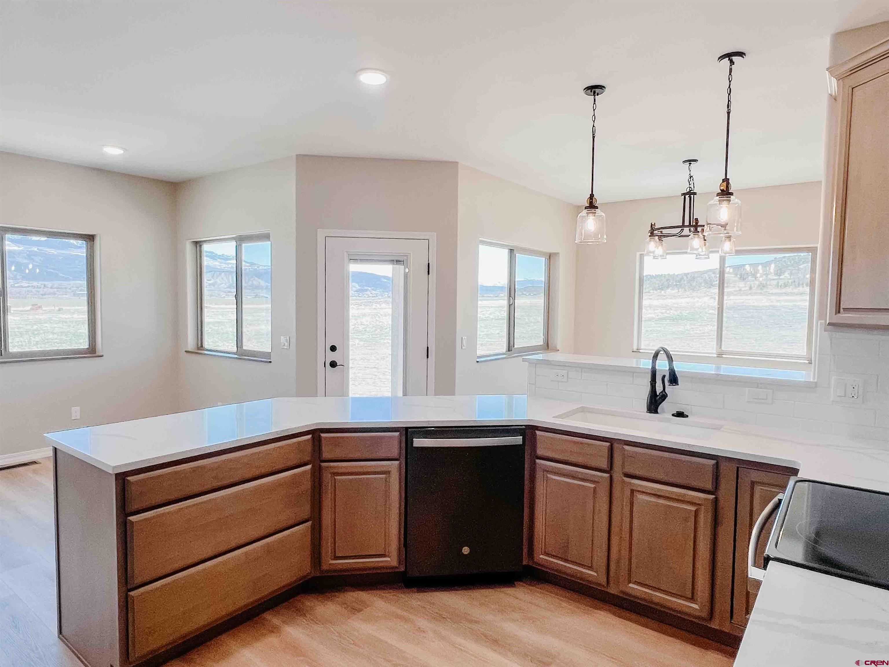 68364 Vernal Road Montrose, CO 81403 - Photo 3 of 11 a kitchen with a sink and stove
