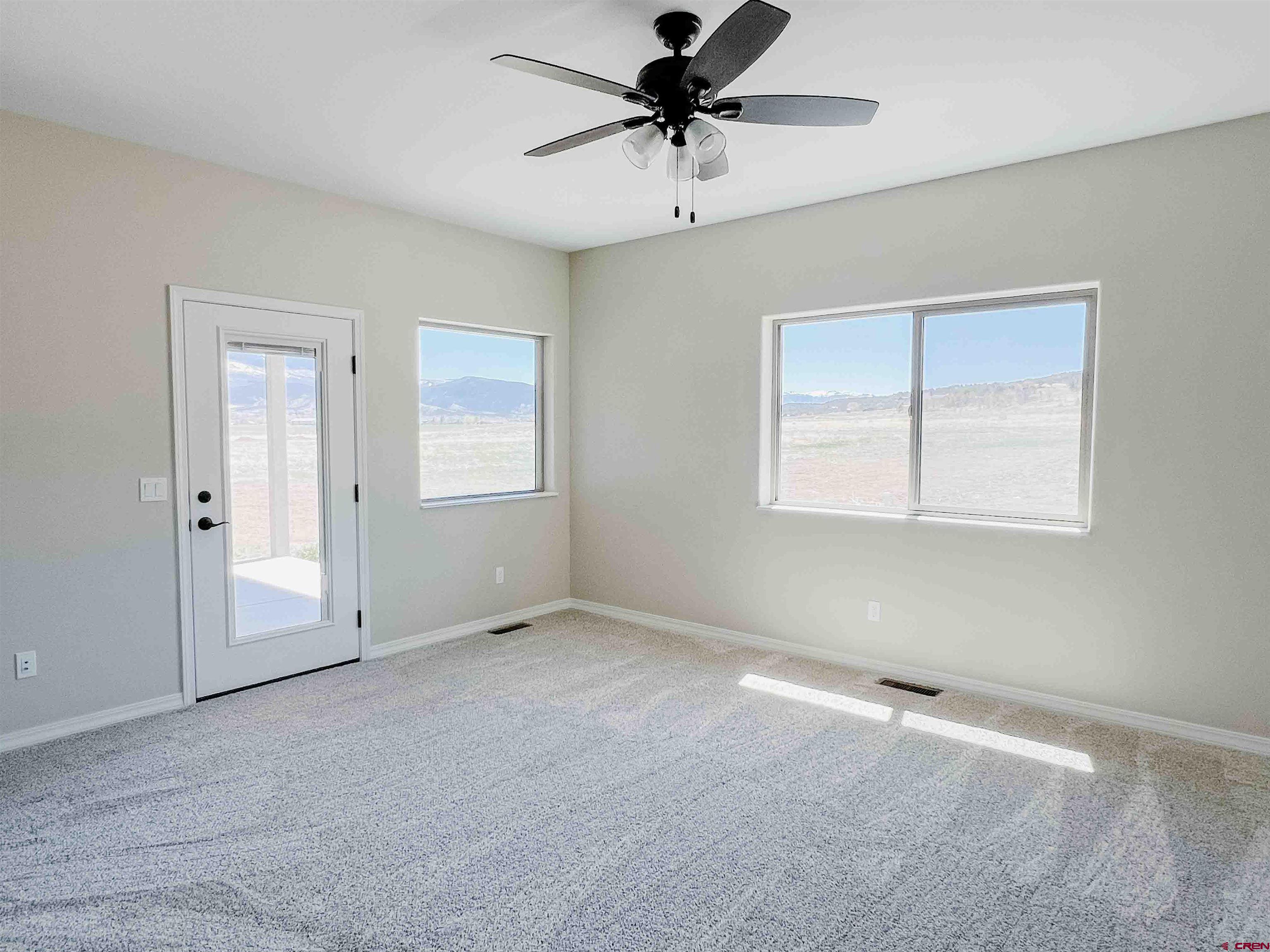 68364 Vernal Road Montrose, CO 81403 - Photo 8 of 11 a view of an empty room with a window