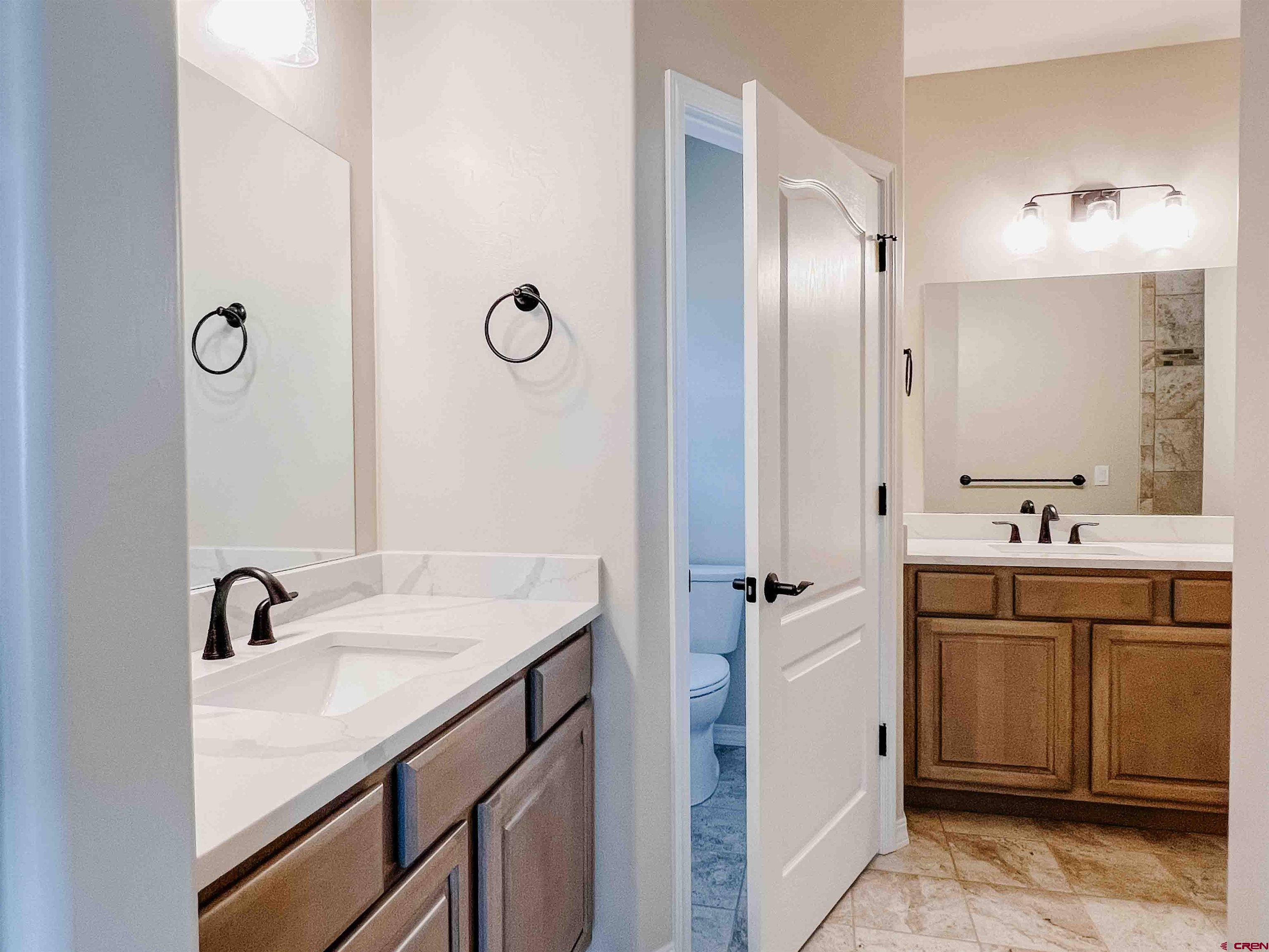 68364 Vernal Road Montrose, CO 81403 - Photo 10 of 11 a bathroom with a sink double vanity and a mirror