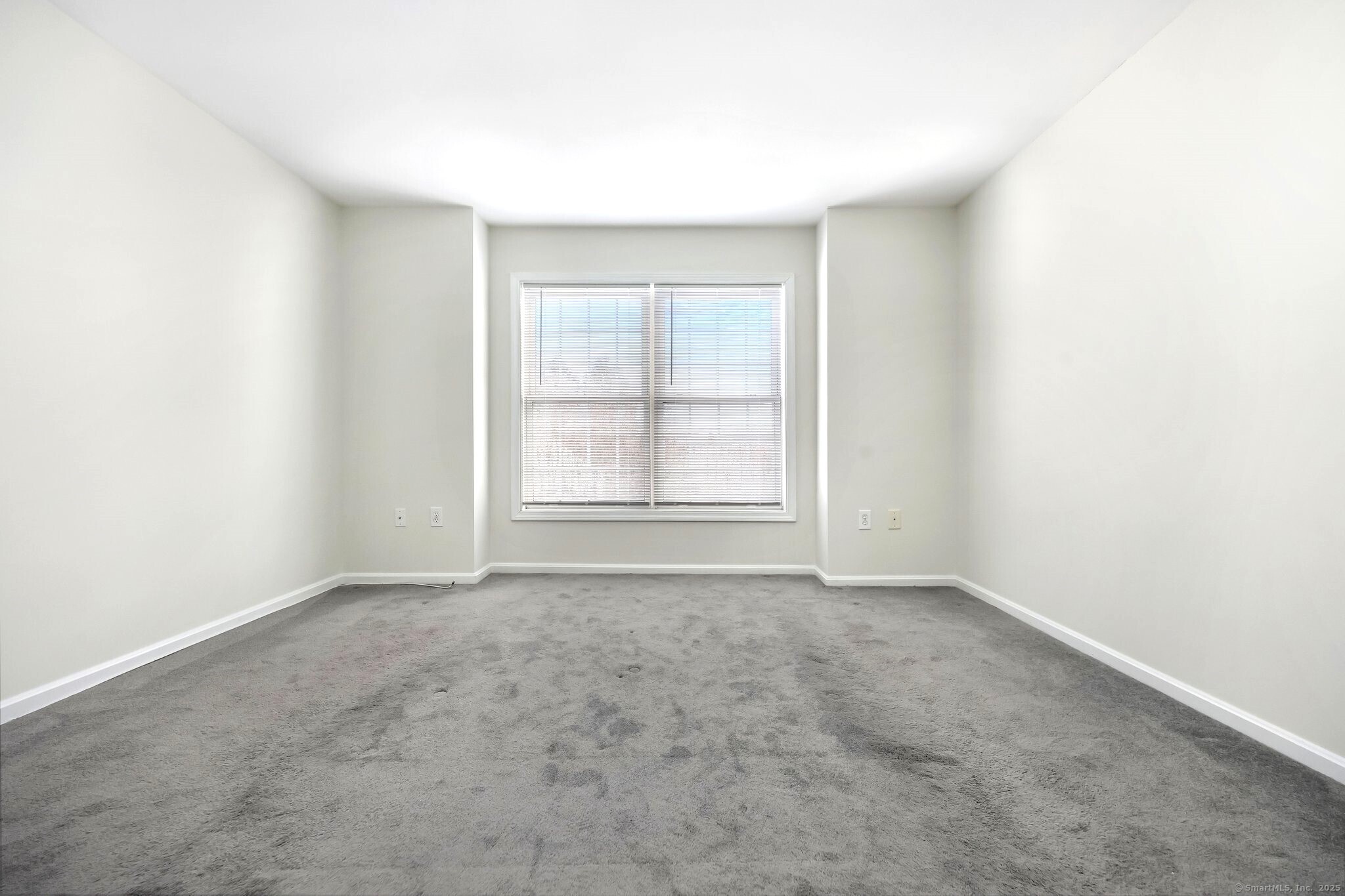 103 Dean Street Stamford, CT 06902 - Photo 6 of 11 an empty room with windows