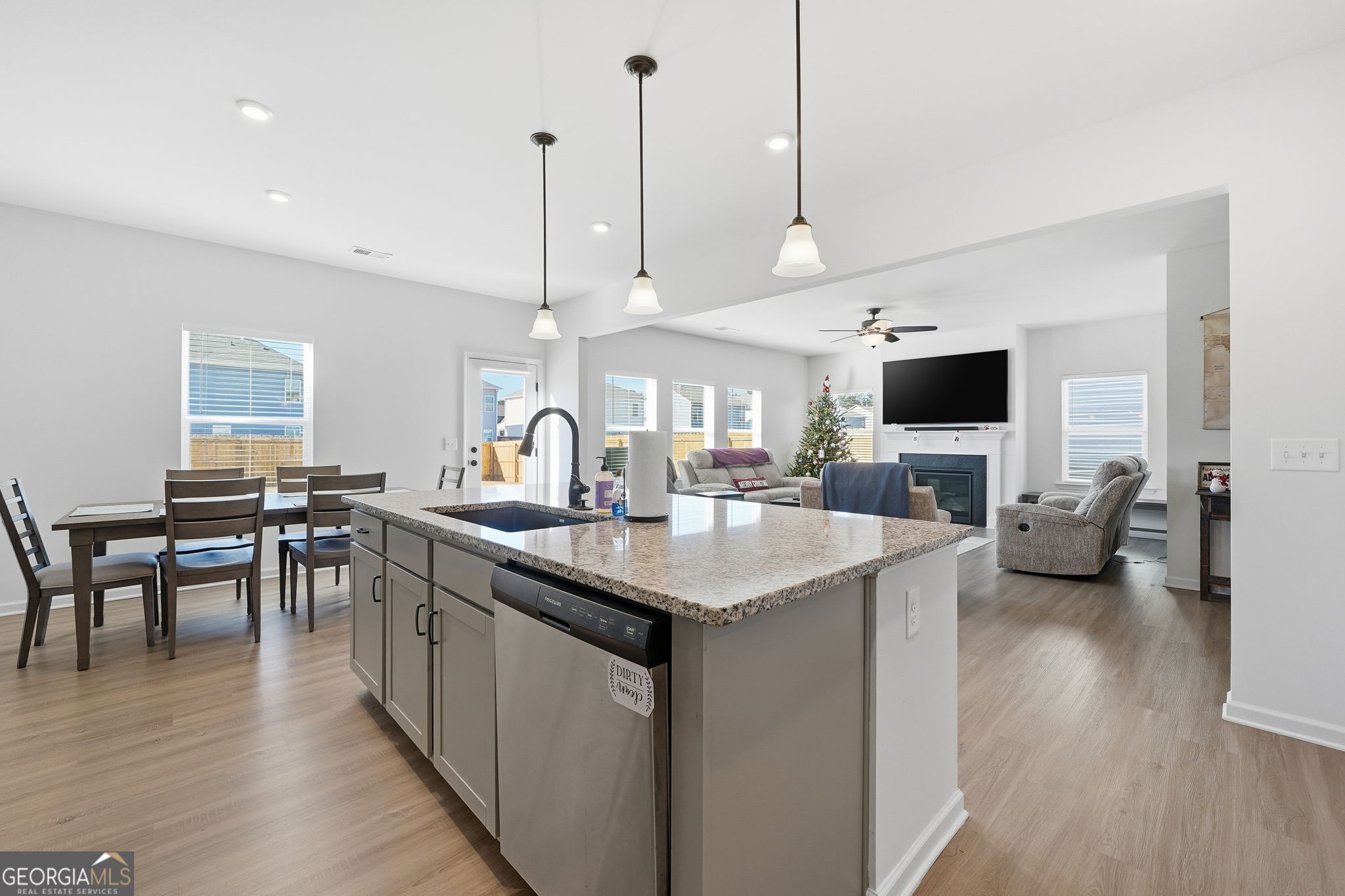 199 Graham Circle Adairsville, GA 30103 - Photo 16 of 49 a kitchen with sink stove and wooden floor