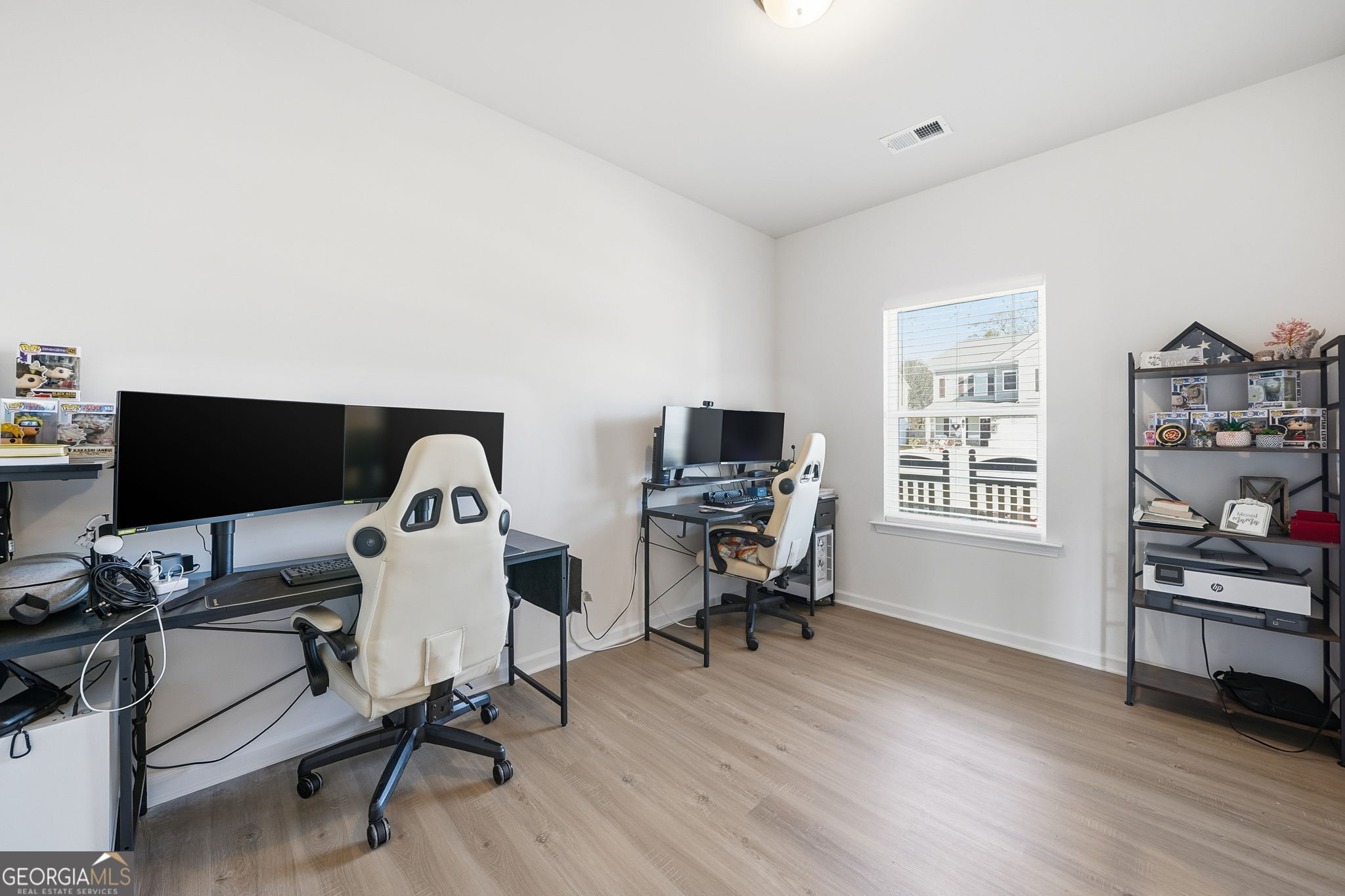 199 Graham Circle Adairsville, GA 30103 - Photo 19 of 49 a workspace with furniture and wooden floor