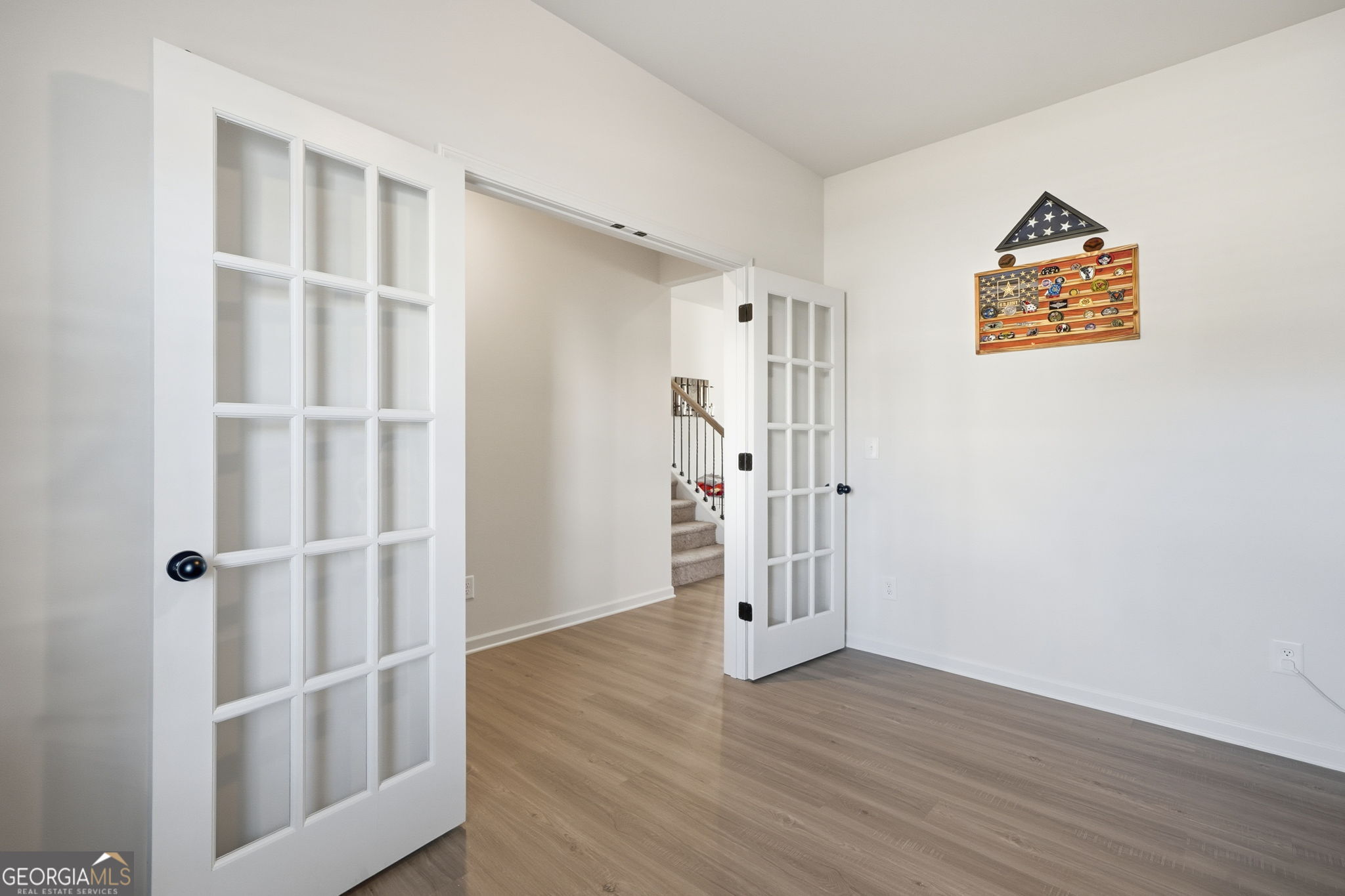 199 Graham Circle Adairsville, GA 30103 - Photo 20 of 49 an empty room with wooden floor and windows