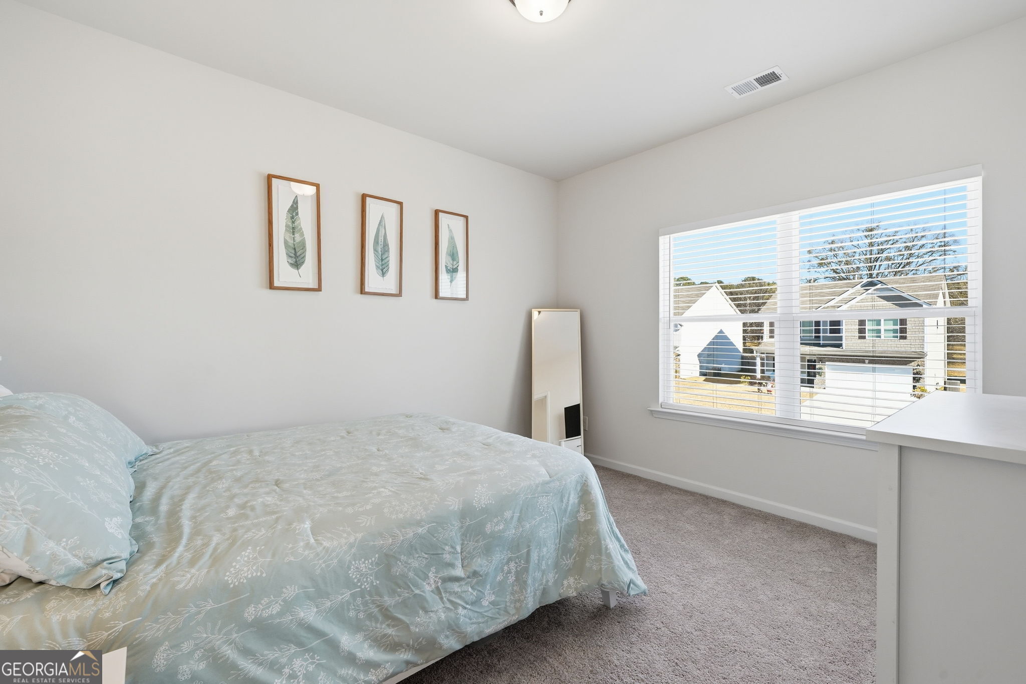 199 Graham Circle Adairsville, GA 30103 - Photo 26 of 49 a bedroom with a bed and a large window