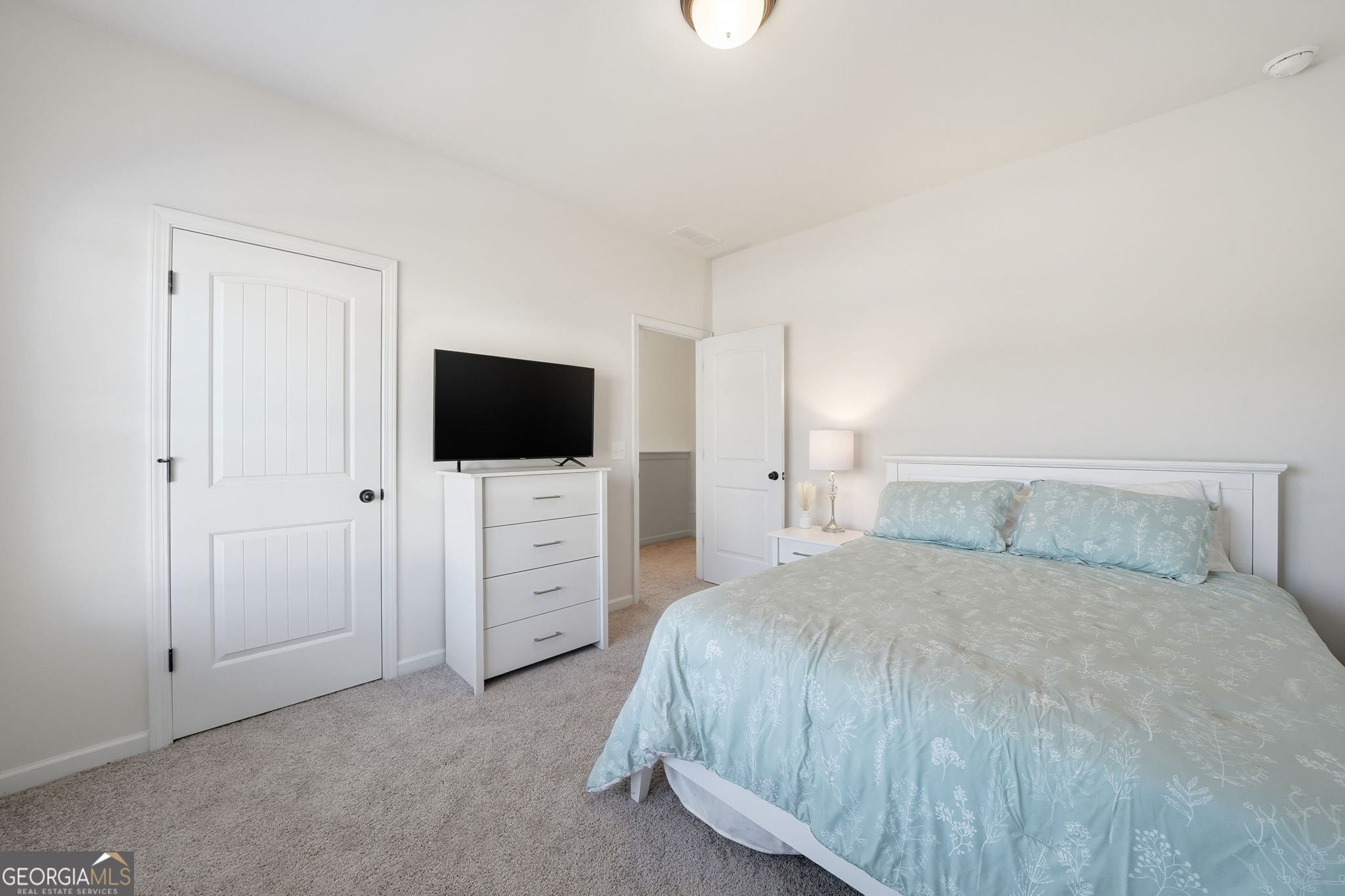 199 Graham Circle Adairsville, GA 30103 - Photo 27 of 49 a bedroom with a bed and a flat screen tv