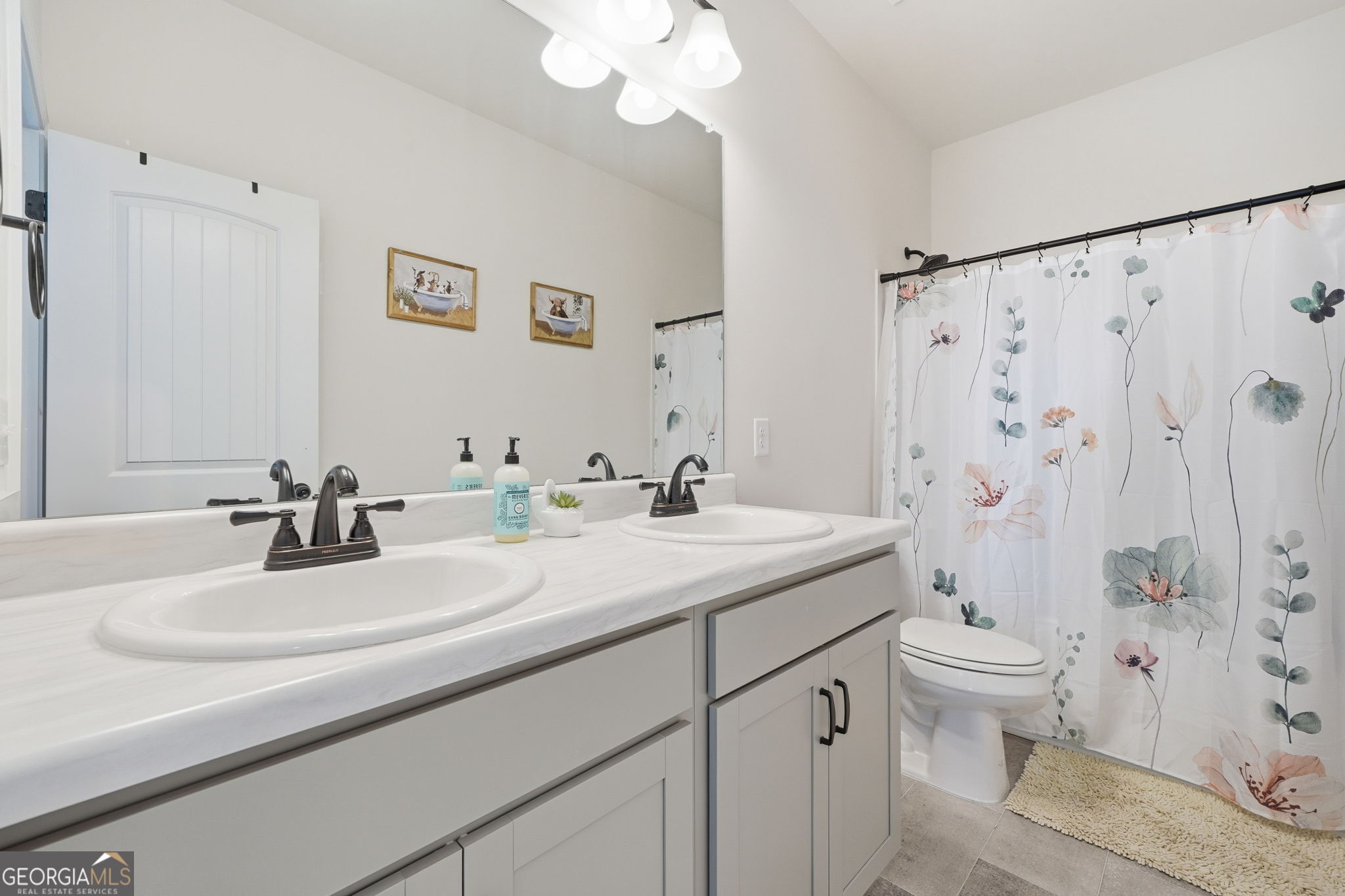 199 Graham Circle Adairsville, GA 30103 - Photo 28 of 49 a bathroom with a double vanity sink mirror and toilet