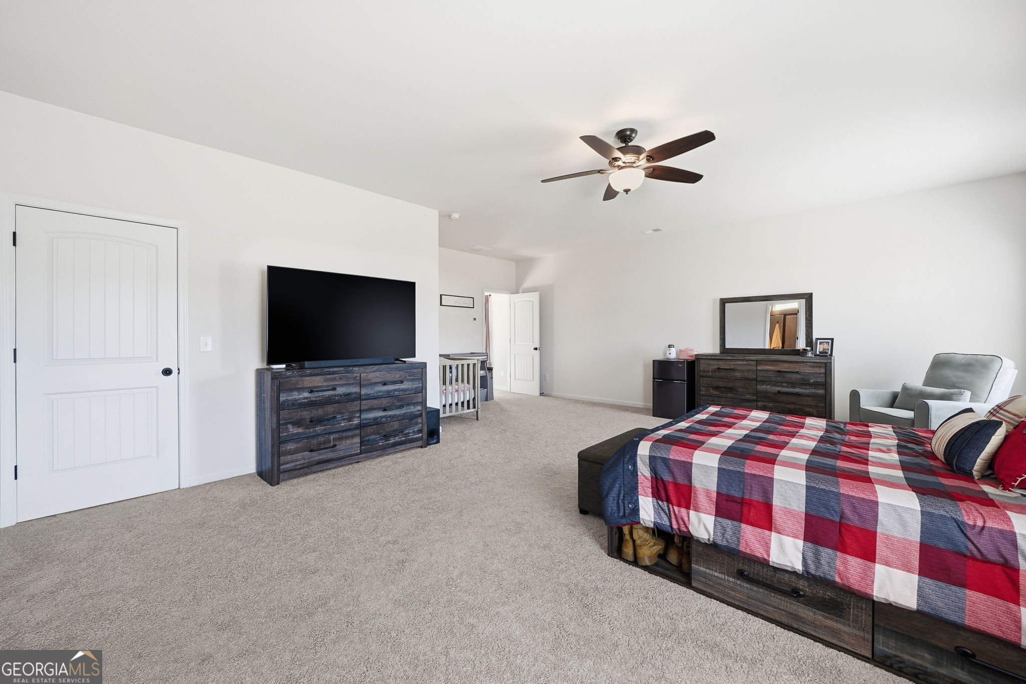 199 Graham Circle Adairsville, GA 30103 - Photo 31 of 49 a bedroom with a bed and a flat screen tv