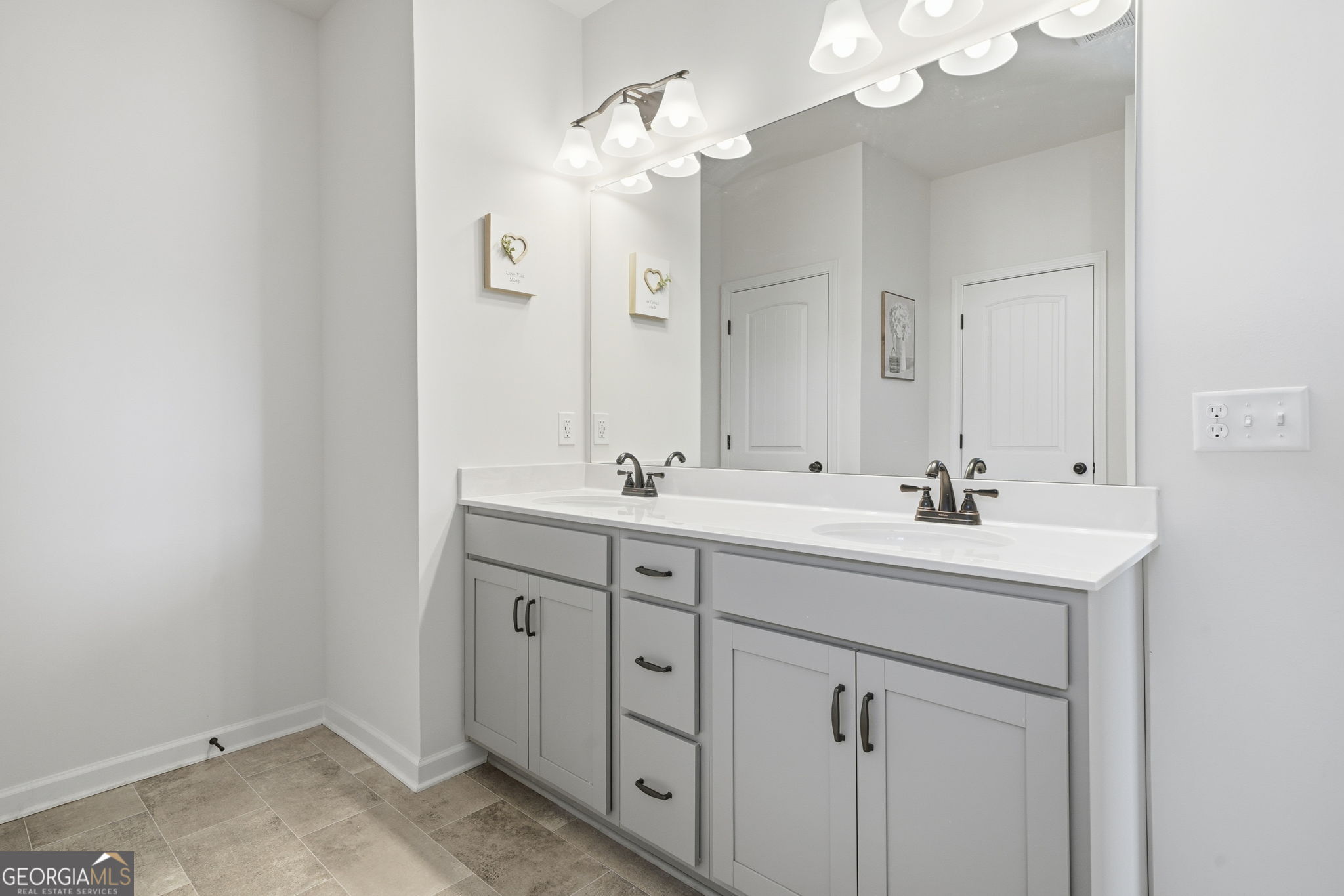 199 Graham Circle Adairsville, GA 30103 - Photo 32 of 49 a bathroom with 2 sink and a mirror
