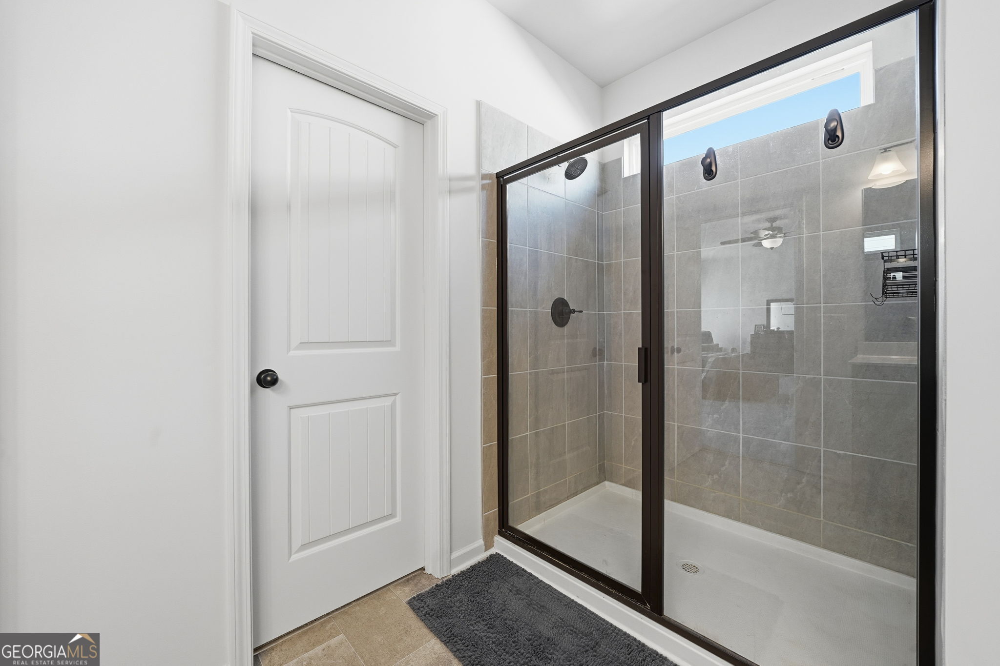 199 Graham Circle Adairsville, GA 30103 - Photo 33 of 49 a bathroom with a glass shower door