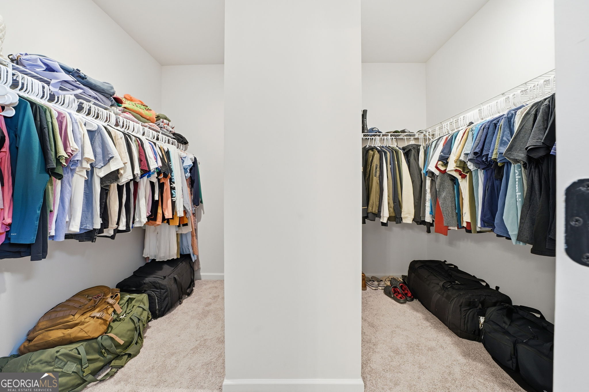 199 Graham Circle Adairsville, GA 30103 - Photo 34 of 49 a view of walk in closet with clothes and shoes