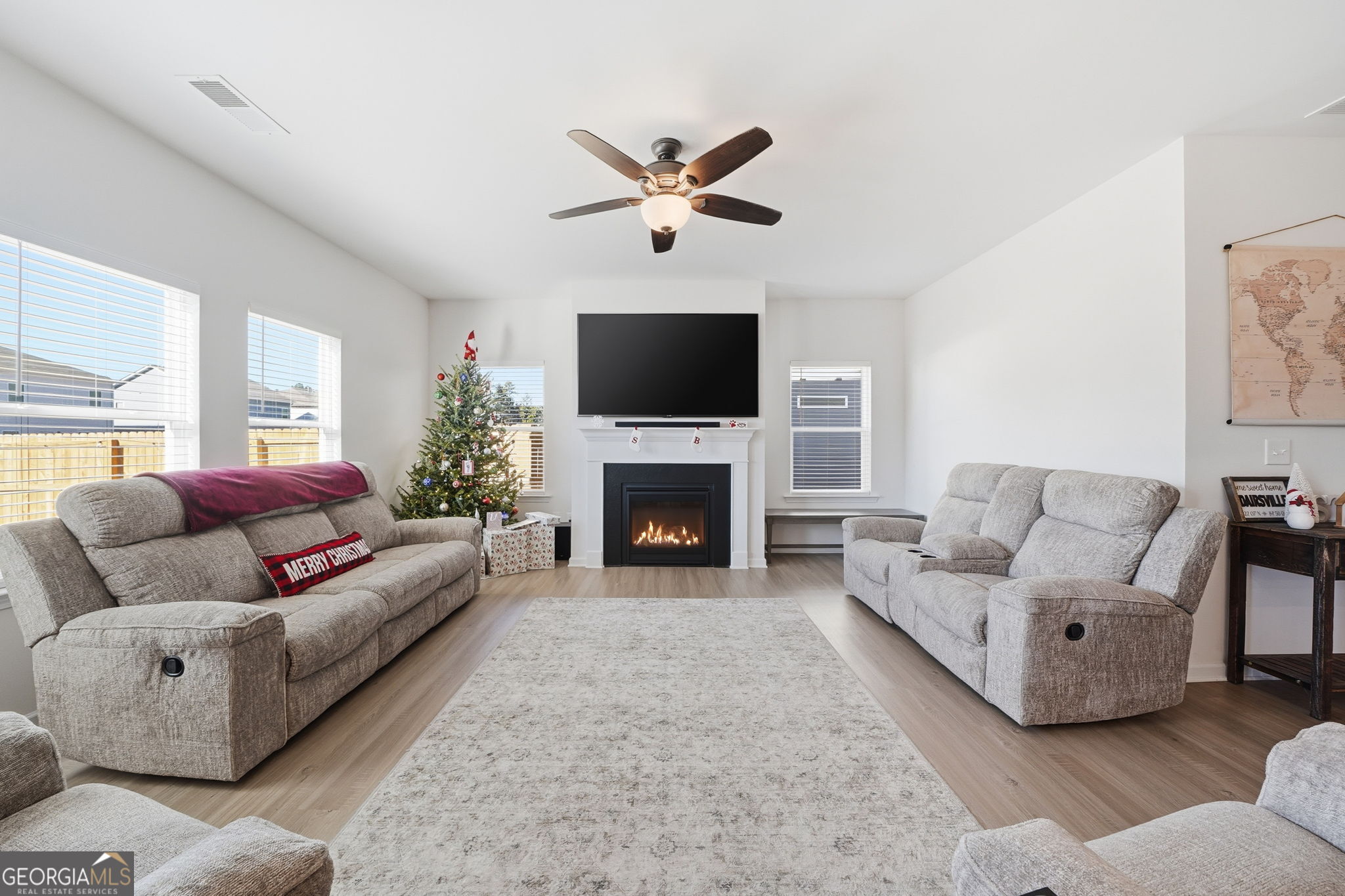 199 Graham Circle Adairsville, GA 30103 - Photo 8 of 49 a living room with furniture a fireplace and a flat screen tv