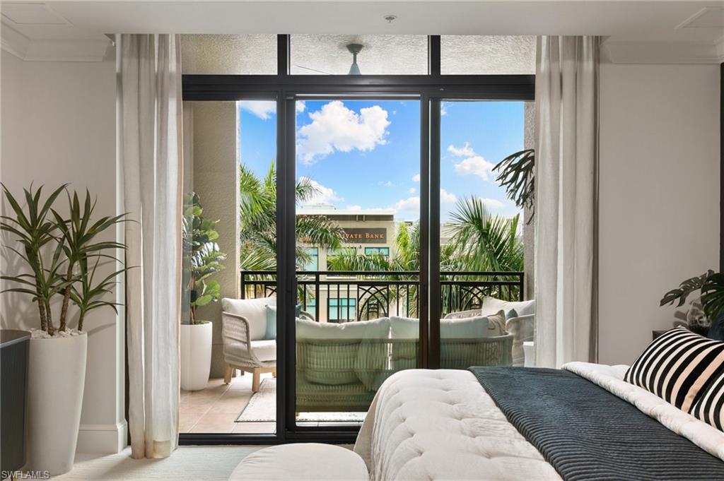 9115 Strada Place, Unit 5406 Naples, FL 34108 - Photo 28 of 50 a living room with furniture and a large window