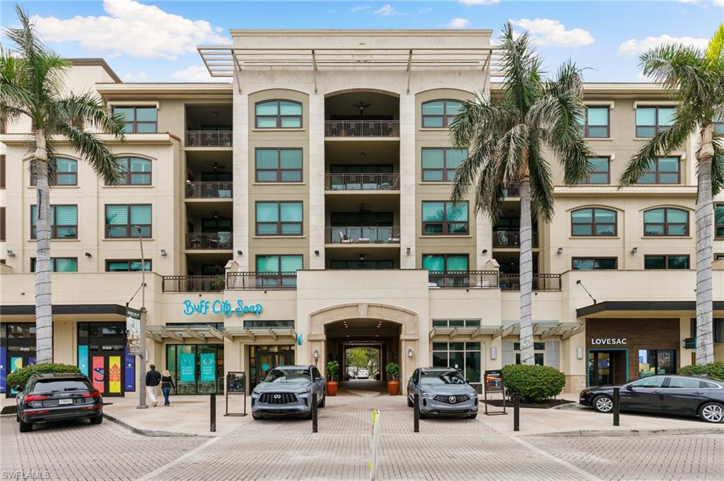 9115 Strada Place, Unit 5406 Naples, FL 34108 - Photo 35 of 50 front view of a building with a street