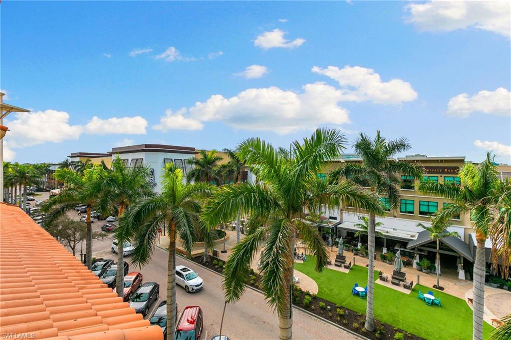 9115 Strada Place, Unit 5406 Naples, FL 34108 - Photo 40 of 50 a view of swimming pool with outdoor seating and city view