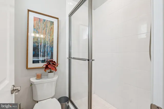 a bedroom with furniture window and wooden floor