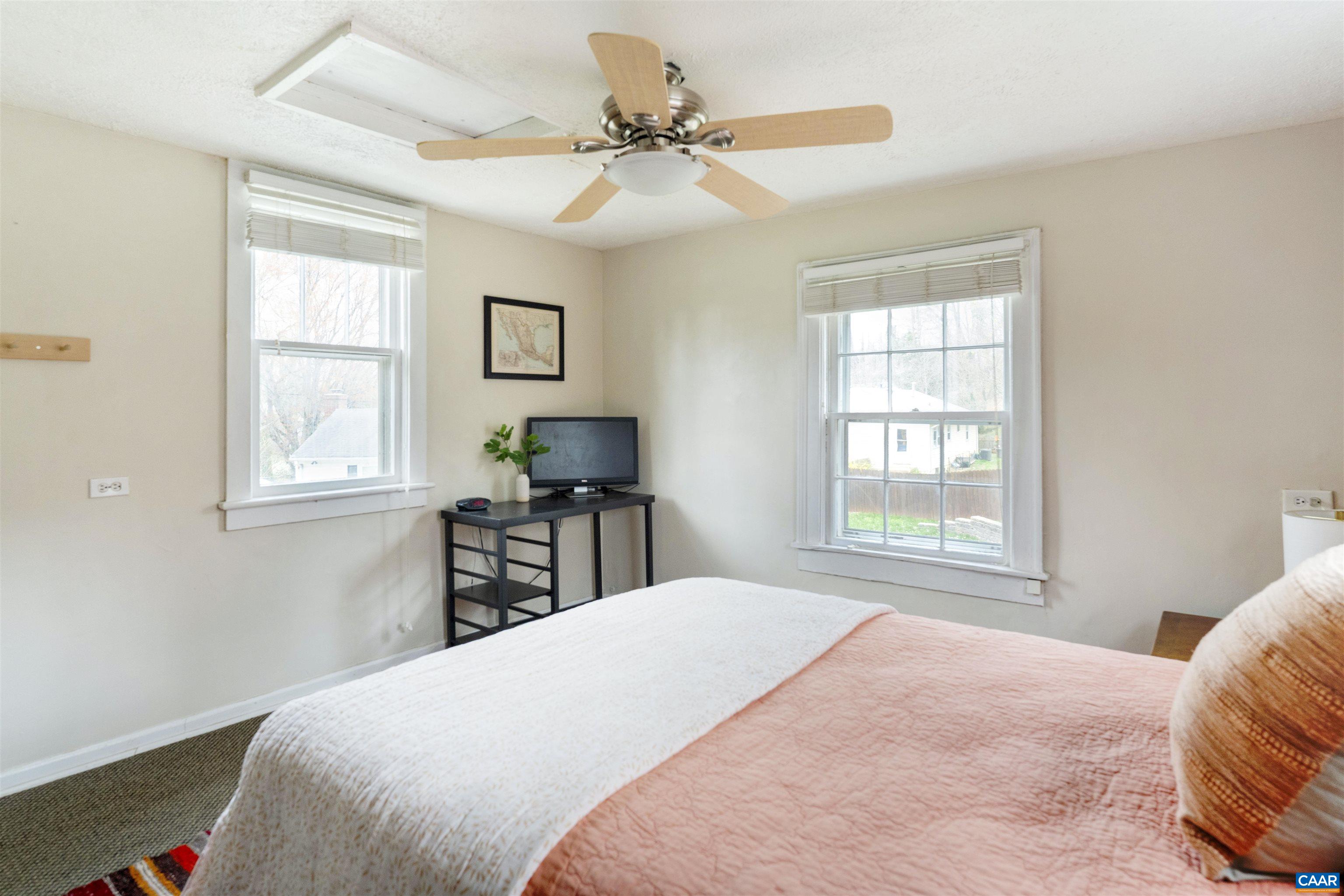 1625 Grove St Extension Charlottesville, VA 22903 - Photo 13 of 24 a bedroom with a large bed and a window
