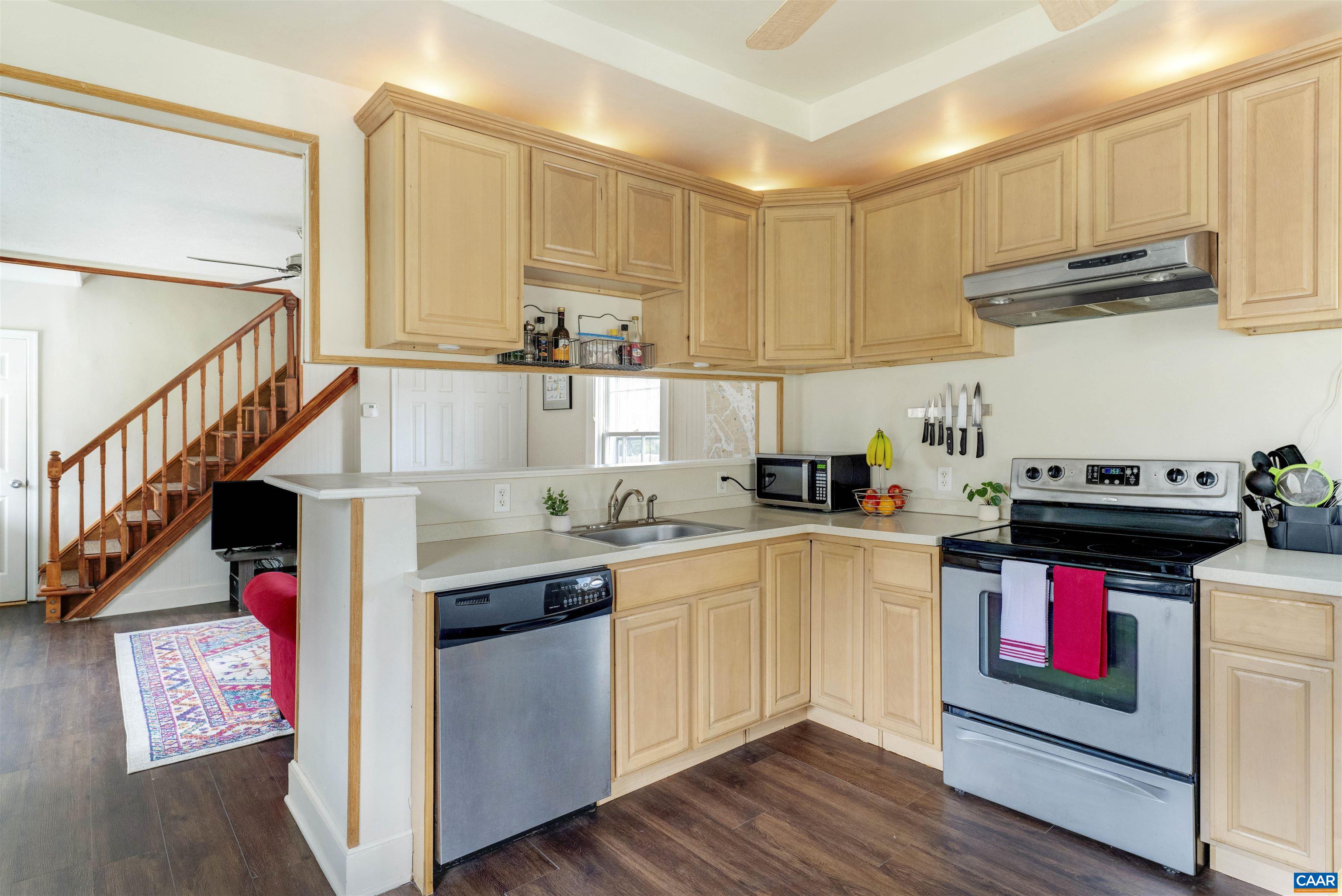 1625 Grove St Extension Charlottesville, VA 22903 - Photo 9 of 24 a kitchen with stainless steel appliances granite countertop a sink and cabinets
