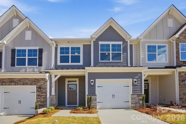 a front view of a house with a garage
