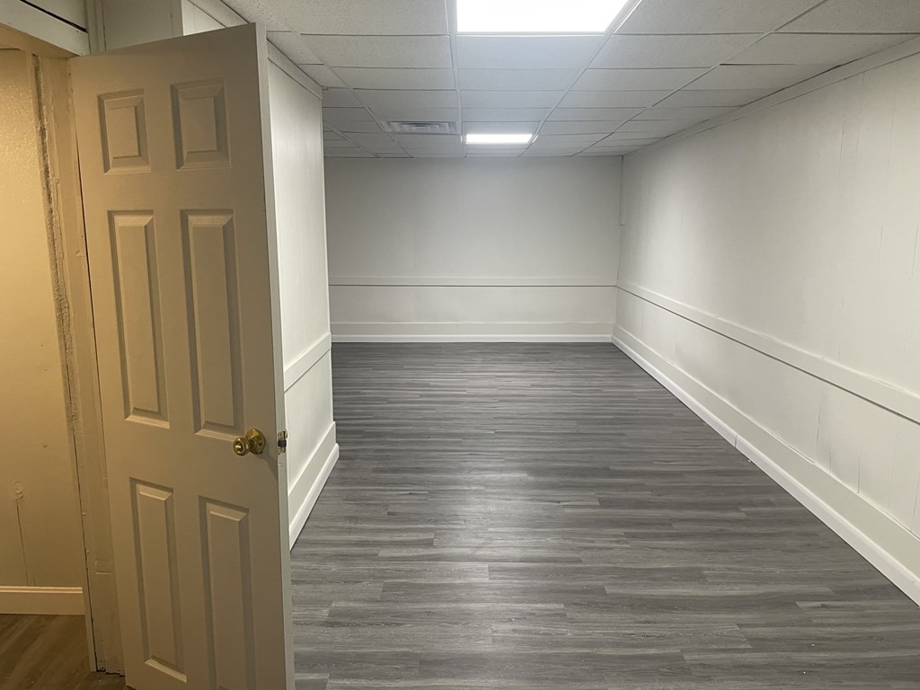159 Nashua Street Fall River, MA 02721 - Photo 11 of 15 a view of a small space with wooden floor and staircase