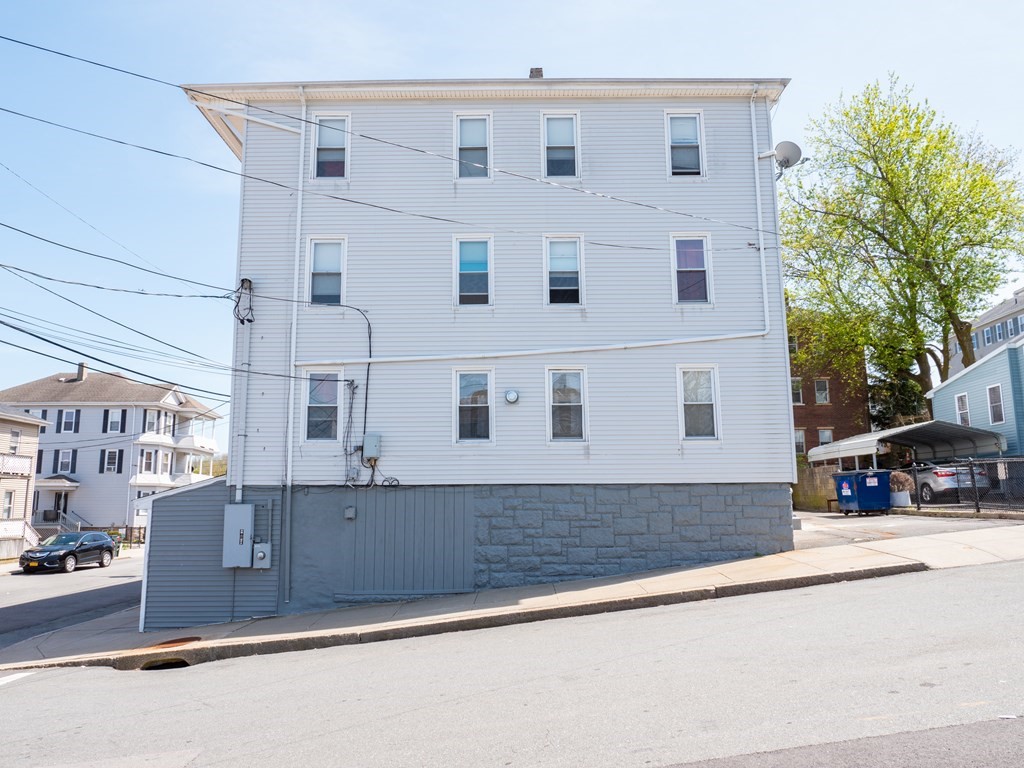 159 Nashua Street Fall River, MA 02721 - Photo 3 of 15 a view of a house with a street