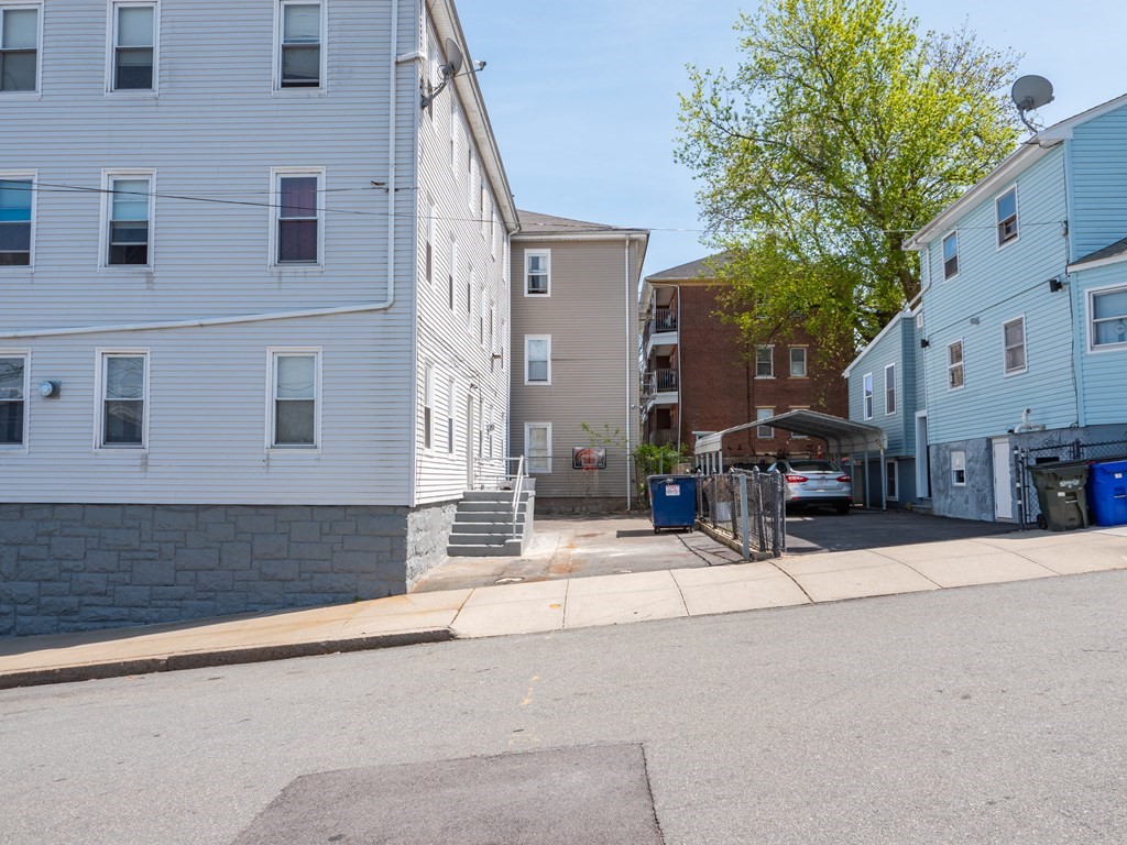 159 Nashua Street Fall River, MA 02721 - Photo 7 of 15 a view of a building with a street