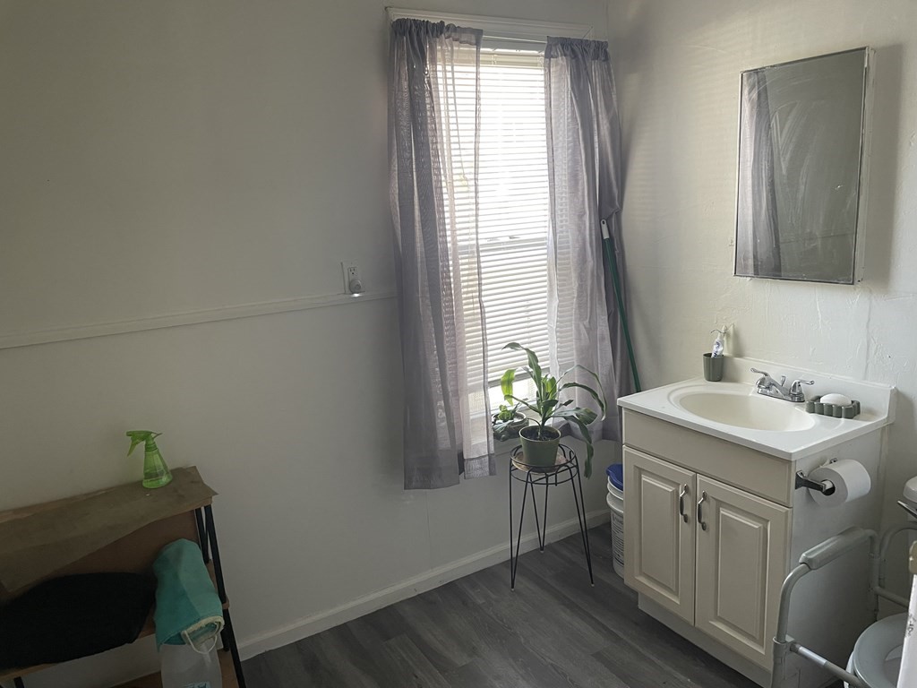159 Nashua Street Fall River, MA 02721 - Photo 10 of 15 a bathroom with a sink and a mirror