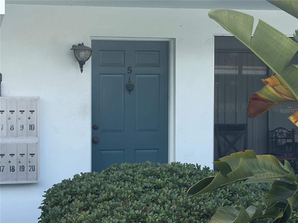 1485 Lakeview Road, Unit 5 Clearwater, FL 33756 - Photo 3 of 3 a room with bed and a painting on wall